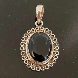 Vintage oval black onyx gemstone pendant set in 925 sterling silver frame